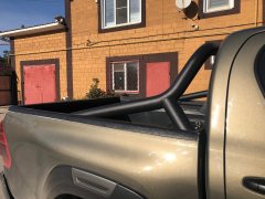 Тюнинг внедорожника Защитные дуги кузова Toyota Hilux Black Onyx 2020