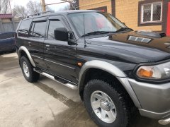 Тюнинг внедорожника Порог труба с проступью Mitsubishi Pajero Sport 1998-2007