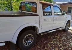 Тюнинг внедорожника Порог труба с проступью Mazda BT-50 2006